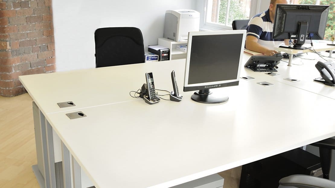white desks in an office