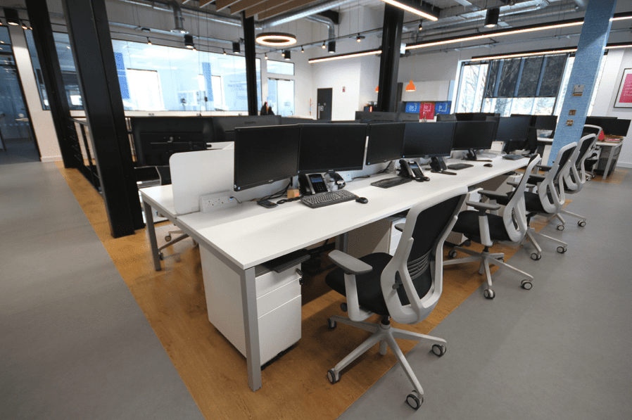Image shows a very tidy desks workspace - fit out and design by Ben Johnson Interiors